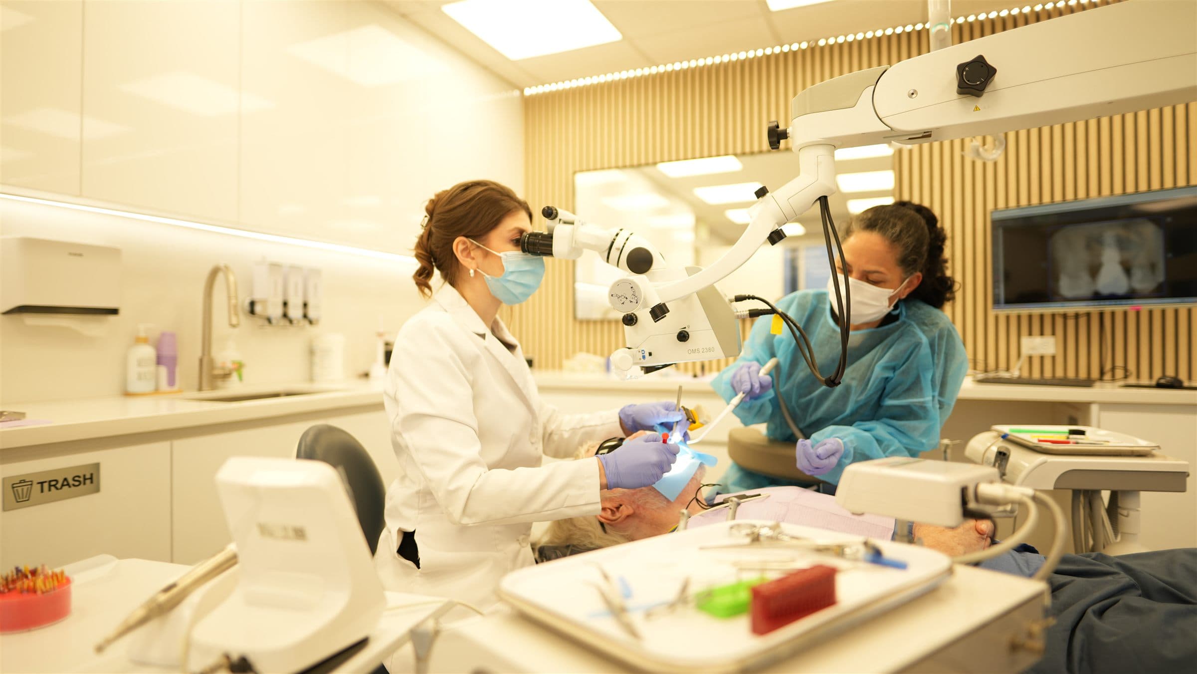 Modern endodontic treatment room with microscope at Bixby Endodontics